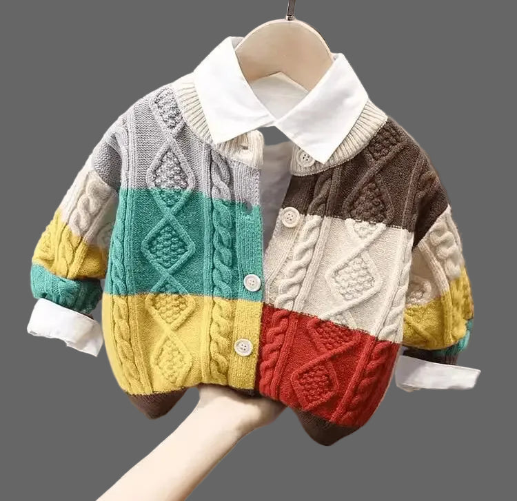 Colorful patchwork sweater on a hanger against a neutral background