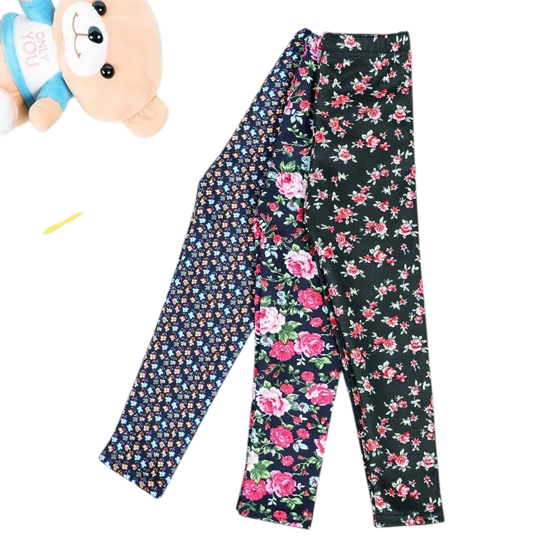 Kcoral Kids floral print winter leggings for girls with velvet lining and elastic waist, displayed with pencils